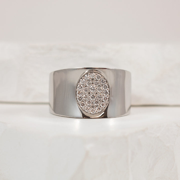 14KW 'Oval' Cluster Wide Diamond Ring             
14K White Gold Natural Diamond Ring
0.28 Total Natural Round Brilliant Cut Diamond Weight SI Clarity, G Colour
Finger Size 8.25