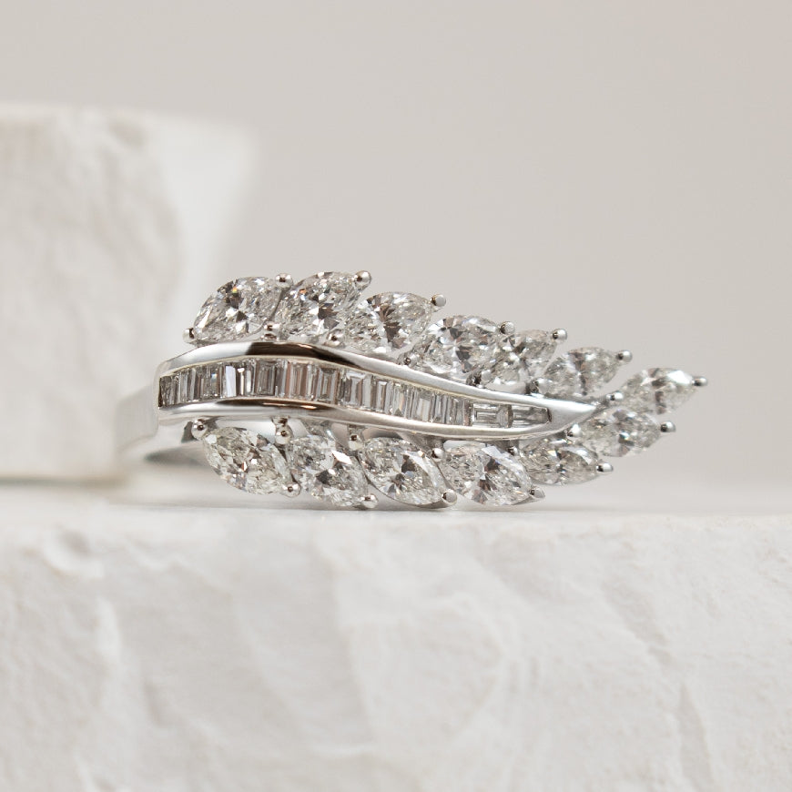 14KW Marquise & Baguette Cut Diamond Leaf Ring    
14K White Gold Natural Diamond Leaf Ring
1.03 Total Marquise & Baguette Cut Natural Diamond Weight of SI Clarity, GH Colour
Finger Size 6.5
