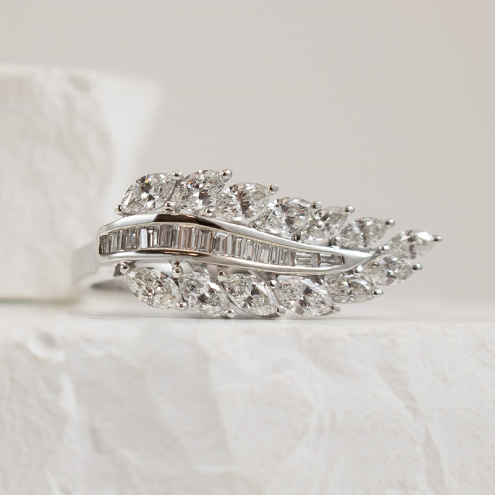 14KW Marquise & Baguette Cut Diamond Leaf Ring    
14K White Gold Natural Diamond Leaf Ring
1.03 Total Marquise & Baguette Cut Natural Diamond Weight of SI Clarity, GH Colour
Finger Size 6.5