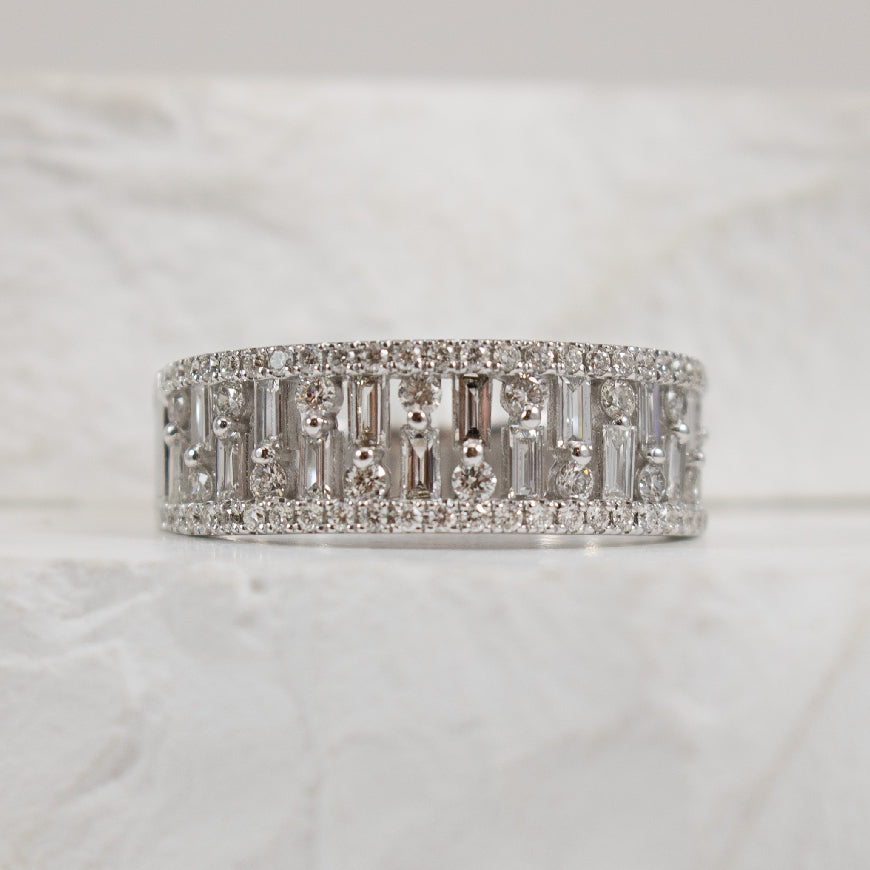 14KW Roman & Jules Diamond Baguette Ring           
14K White Gold Roman & Jules Natural Diamond Ring
0.39 Total Natural Baguette Diamond Weight 
0.40 Total Natural Round Brilliant Cut Diamond Weight
0.79 Total Natural Diamond Weight SI1-2