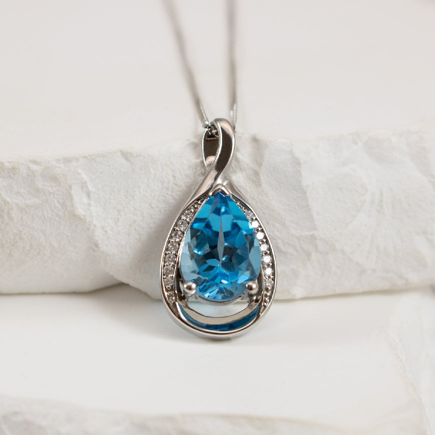 10KW Blue Topaz & Diamond Necklace
10K White Gold Blue Topaz & Diamond Necklace
Chain Length 18'