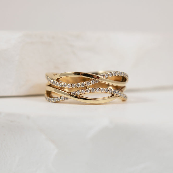 14KY Modern Look Diamond Twist Ring              
14K Yellow Gold Natural Diamond Twist Ring
0.20 Total Natural Diamond Weight
Finger Size 6.5
