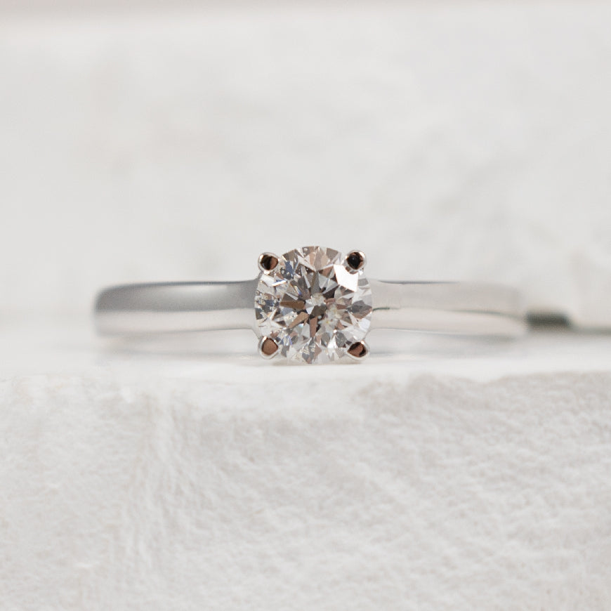 14KW Solitaire 0.50CT Diamond Engagement Ring     
14K White Gold Natural Diamond Solitaire Engagement Ring 
Center Diamond - 0.50 Carat Round Brilliant Cut Natural Diamond of I1-2 Clarity, H-I Colour 
Finger Size 6.25