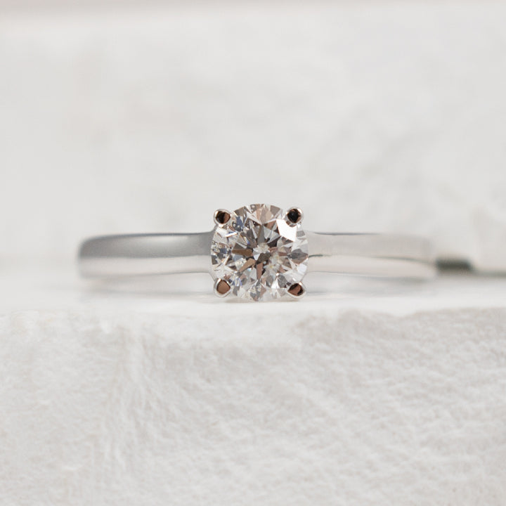14KW Solitaire 0.50CT Diamond Engagement Ring     
14K White Gold Natural Diamond Solitaire Engagement Ring 
Center Diamond - 0.50 Carat Round Brilliant Cut Natural Diamond of I1-2 Clarity, H-I Colour 
Finger Size 6.25