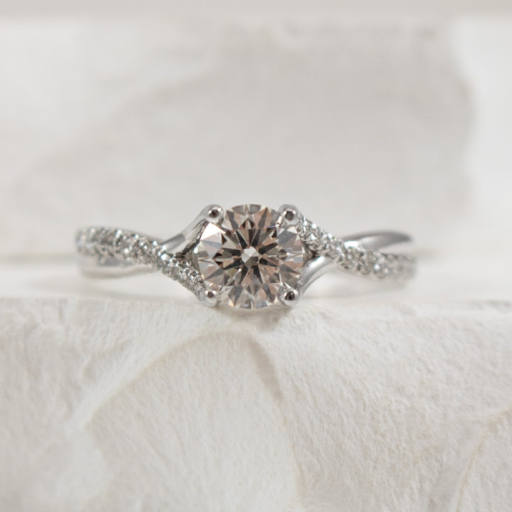 14K White Gold Gabriel & Co. Natural & Lab Grown Diamond Engagement Ring 
Center - 0.74 Carat Round Brilliant Cut Lab Grown Diamond of VS1 Clarity, F Colour, Ideal/ Excellent/ Excellent Cut, IGI Certified 
Accent - 0.16 Carat Total Natural Diam