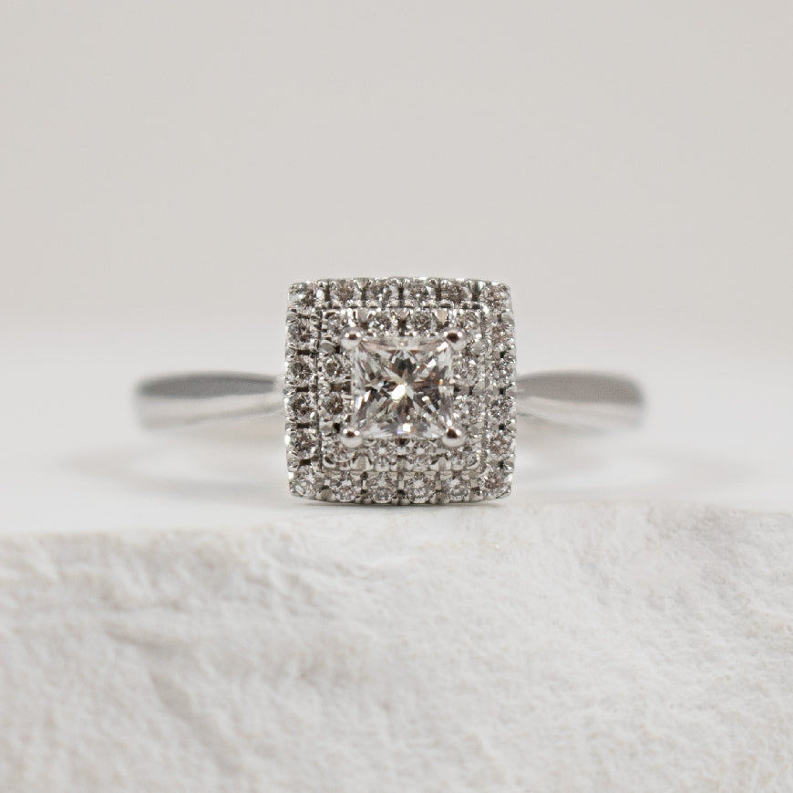 Platinum Princess Diamond Halo Engagement Ring
Platinum Natural Canadian Diamond Halo Engagement Ring
Center - 0.30 Carat Princess Cut Canadian Diamond VS1 Clarity, F Colour
Accent - 0.21 Carats Natural Diamonds
0.51 Total Diamond We