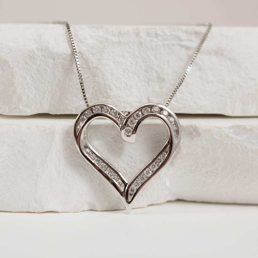 10KW Diamond Heart Necklace
10K White Gold Diamond Heart Necklace
0.25 Total Natural Diamond Weight
Chain Length 18.5'