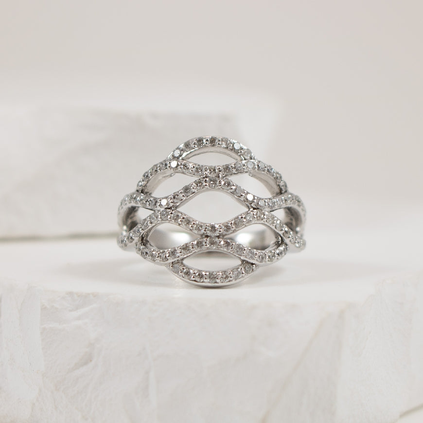 10KW Latticed Diamond Ring
10K White Gold Natural Diamond Ring
0.75 Total Natural Diamond Weight of 12-3 Clarity, IJK Colour
Finger Size 6.5