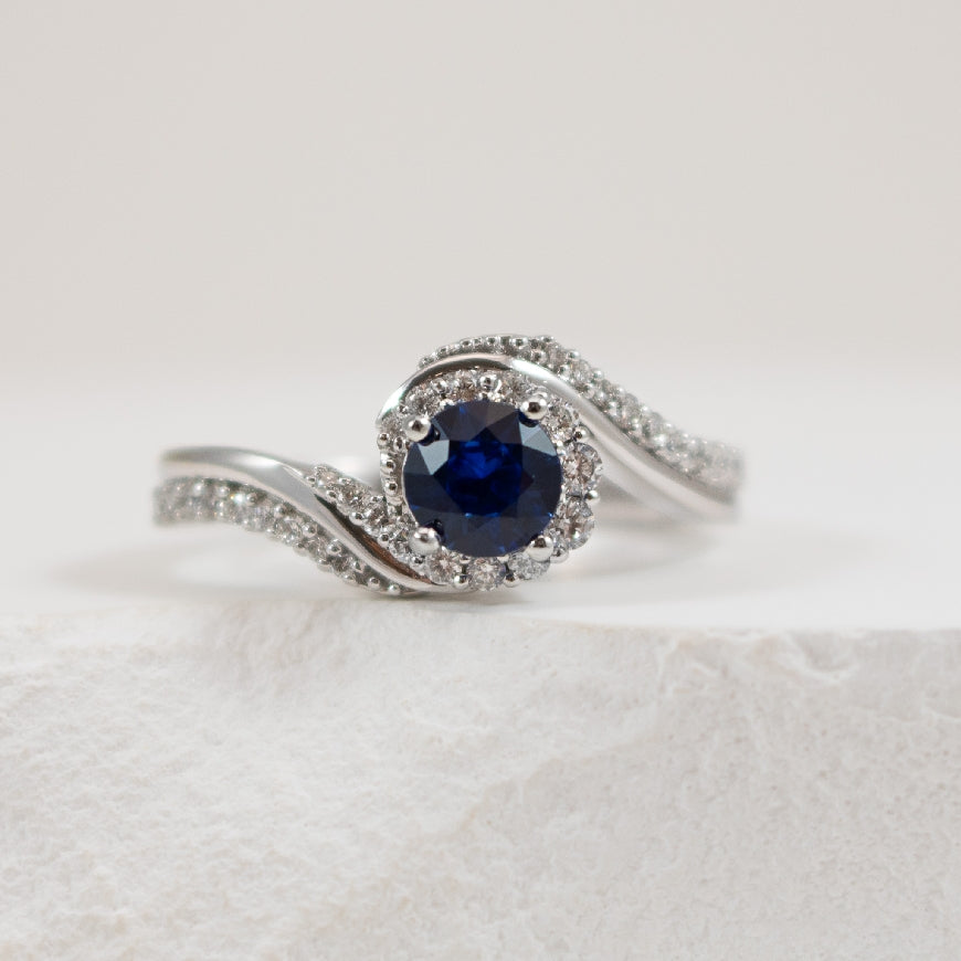 14KW Sapphire & Diamond Bypass Ring
14K White Gold Sapphire & Natural Diamond Bypass Ring
0.65 Total Sapphire Weight of AAA Grading
0.27 Total Natural Diamond Weight
Finger Size