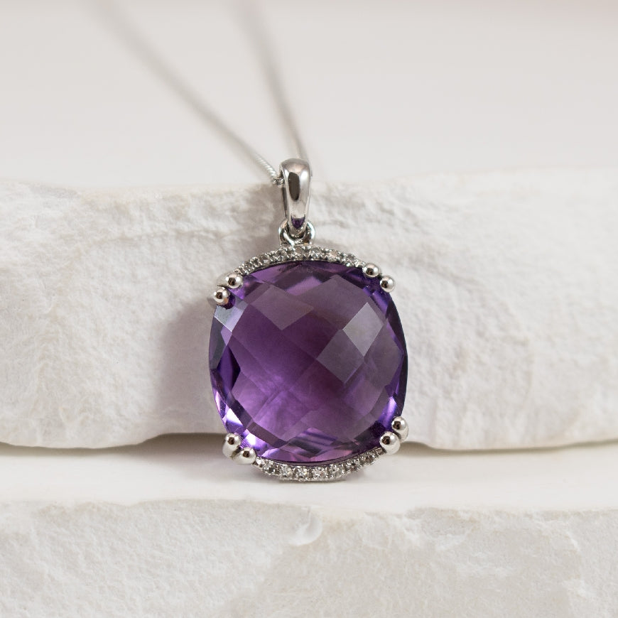 14KW Cushion Cut Amethyst & Diamond Necklace
14K White Gold Amethyst & Diamond Necklace
0.04 Total Natural Diamond Weight
Chain Length 18'