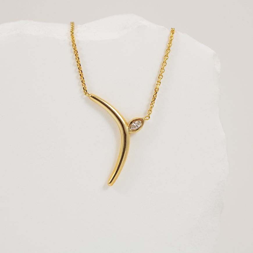 14KY Marquise Diamond 'Boomerang' Necklace
14K Yellow Gold Natural Diamond Marquise Boomerang Necklace
0.04 Carat of Natural Marquise Cut Diamond
Chain Length 18'