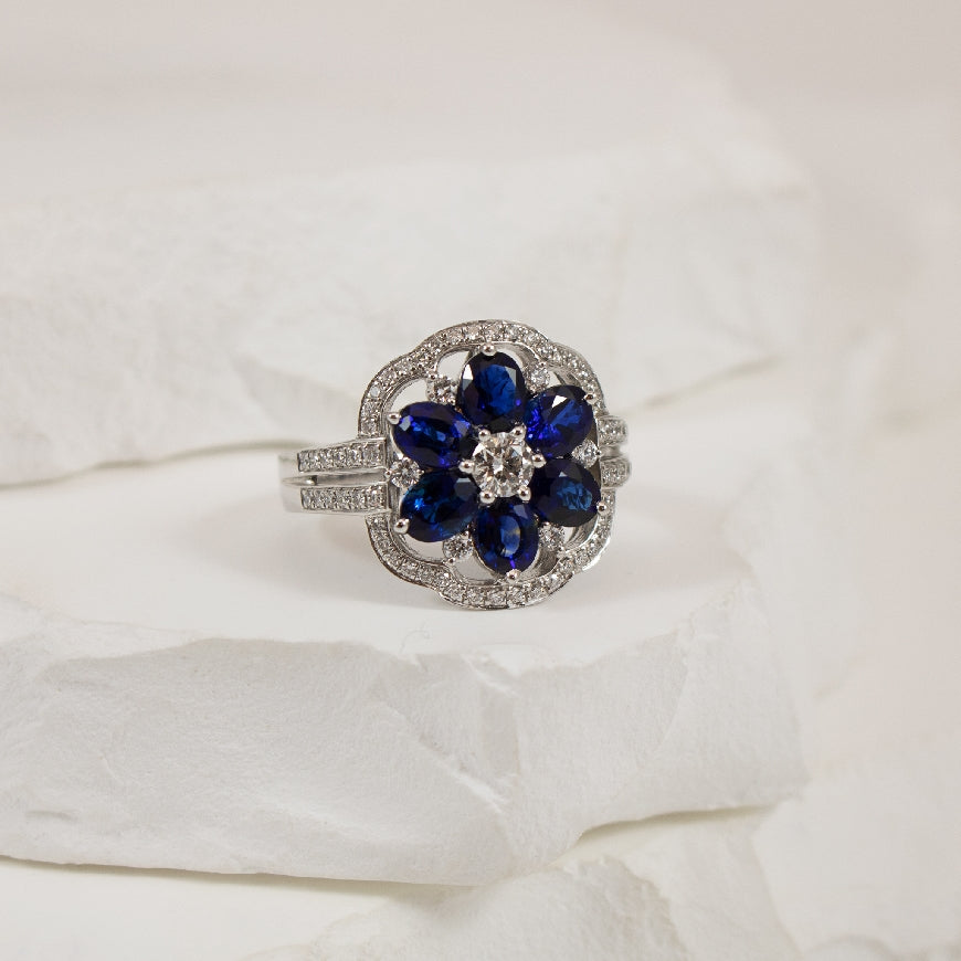 14KW S.Kashi Floral Sapphire & Diamond Ring       
14K White Gold S.Kashi Sapphire & Natural Diamond Ring
2.02 Total Natural Sapphire Weight
0.54 Total Natural Diamond Weight SI1 Clarity, G Colour
Finger Size 6
