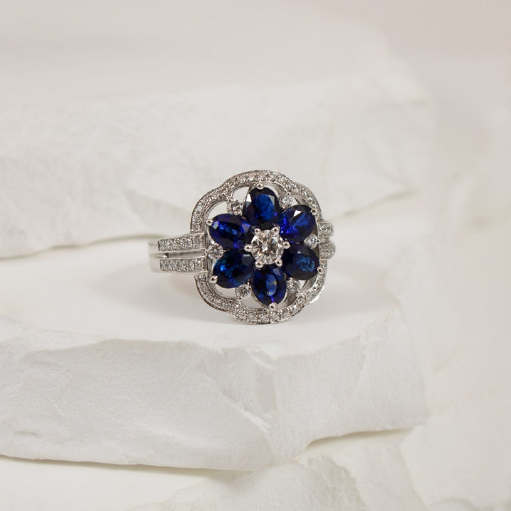14KW S.Kashi Floral Sapphire & Diamond Ring       
14K White Gold S.Kashi Sapphire & Natural Diamond Ring
2.02 Total Natural Sapphire Weight
0.54 Total Natural Diamond Weight SI1 Clarity, G Colour
Finger Size 6
