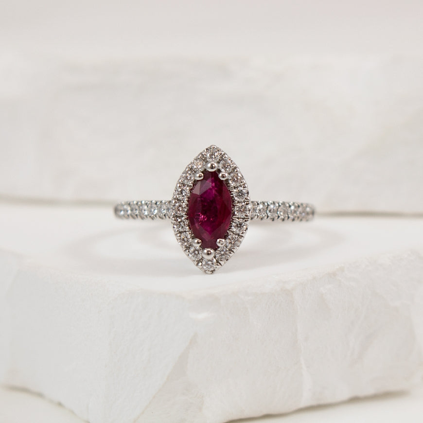 18KW Marquise Cut Ruby & Diamond Halo Ring        
18K White Gold Marquise Cut Ruby & Natural Diamond Halo Ring
0.55 Carat Marquise Cut Ruby
0.29 Total Natural Diamond Weight of SI1-2 Clarity, GH Colour
Finger Size 6.5