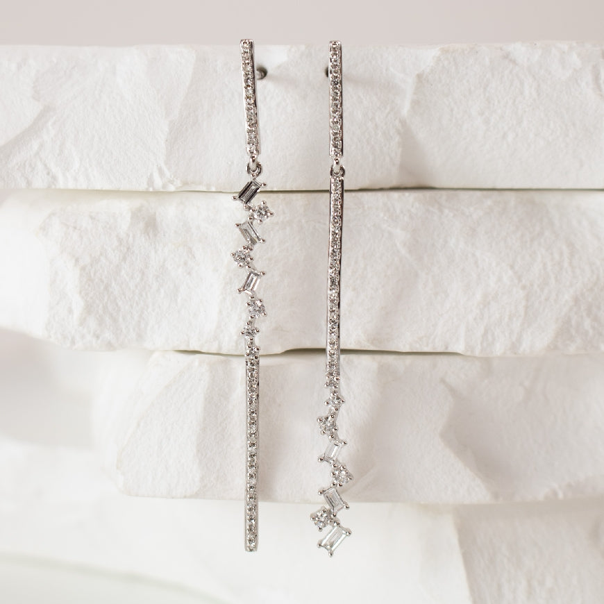 14KW Baguette Diamond Drop Earrings
14K White Gold Natural Diamond Baguette Drop Earrings
0.52 Total Natural Diamond Weight SI1-2 Clarity, GH Colour
Earring Closure Post with Butterfly Back