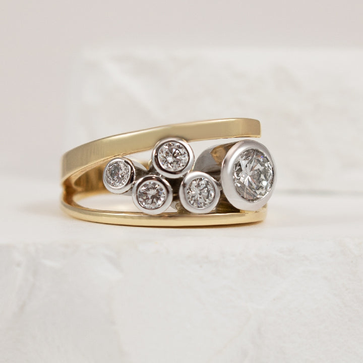 14KY EG Design Forevermark Diamond Bezel Ring  
14K Yellow & White Gold Forevermark Natural Diamond Bezel Ring 
Main - 0.70CT Round Brilliant Cut Forevermark Natural Diamond of SI1 Clarity, H Colour, Excellent/ Excellent/ Very Good Cut, Forever