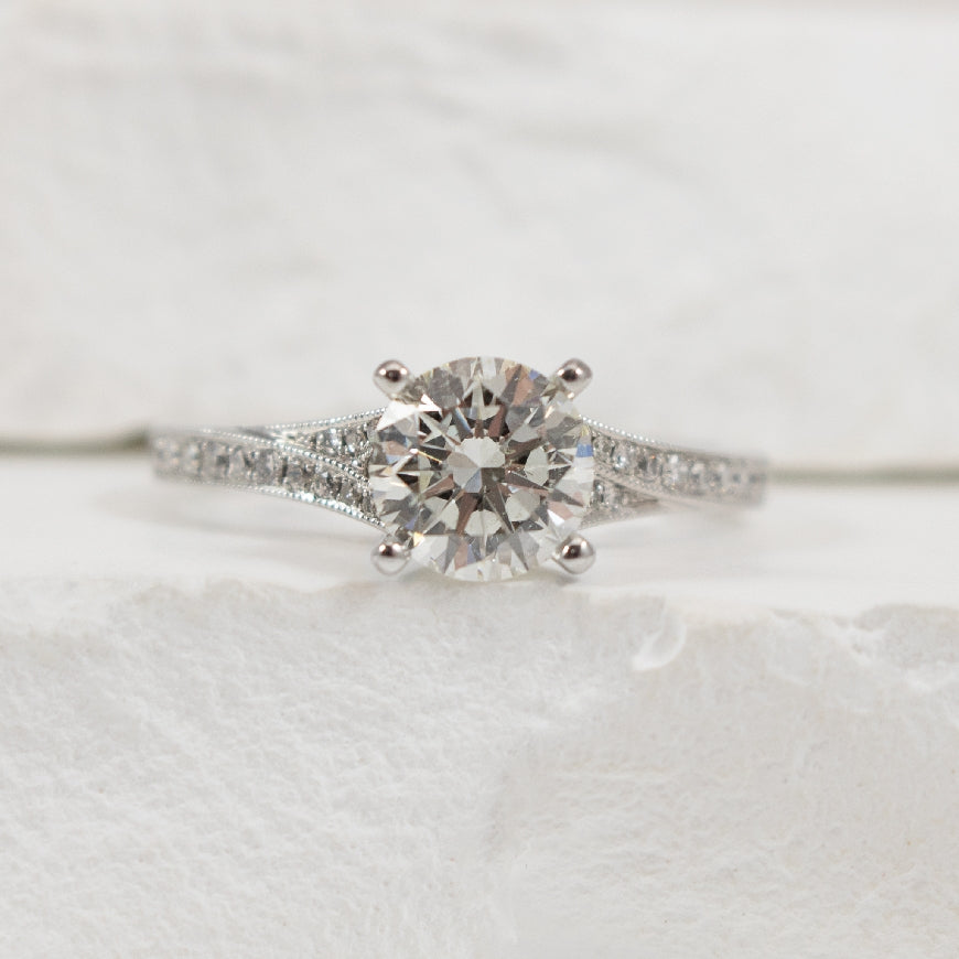 14KW Roman & Jules 1.25CT Diamond Engagement Ring
14K White Gold Roman & Jules Lab Grown Diamond Accented Engagement Ring 
Center- 1.25 Carat Round Brilliant Cut Natural Diamond of VVS2 Clarity, E Colour, Ideal/ Excellent/ Excellent Cut, IGI Ce