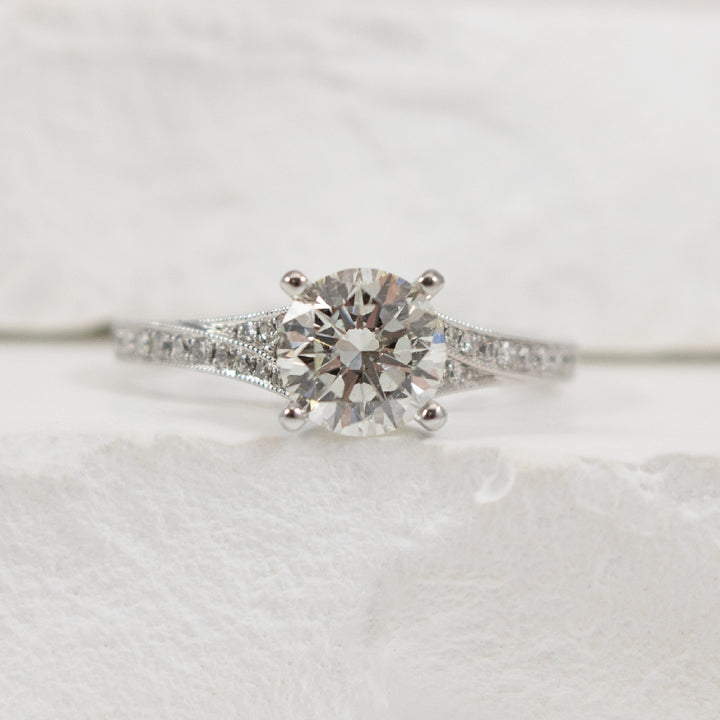 14KW Roman & Jules 1.25CT Diamond Engagement Ring
14K White Gold Roman & Jules Lab Grown Diamond Accented Engagement Ring 
Center- 1.25 Carat Round Brilliant Cut Natural Diamond of VVS2 Clarity, E Colour, Ideal/ Excellent/ Excellent Cut, IGI Ce