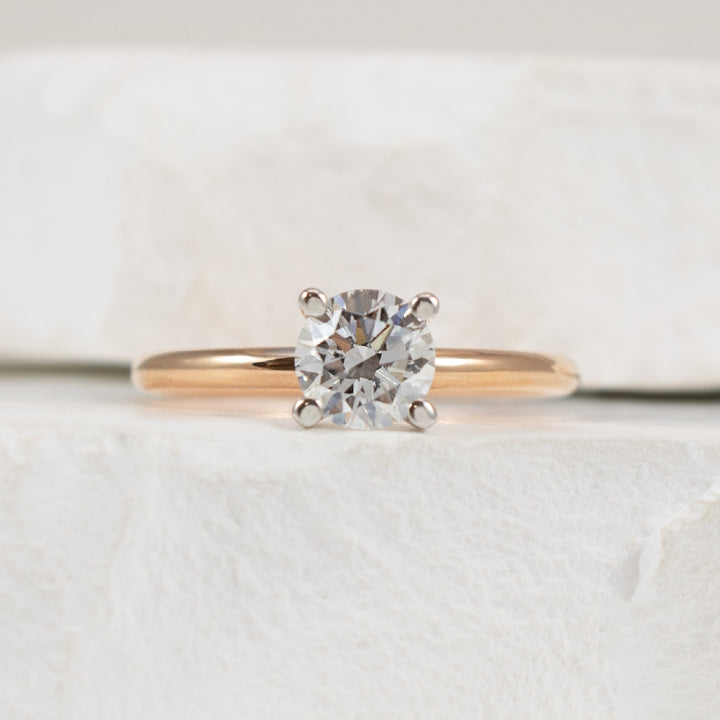 14KR 0.73CT Round Diamond Engagement Ring        
14K Rose & White Gold Lab Grown Diamond Solitaire Engagement Ring 
Center - 0.73 Carat Round Brilliant Cut Lab Grown Diamond of  
VS2 Clarity, H Colour, Excellent/ Excellent/ Excellent Cut