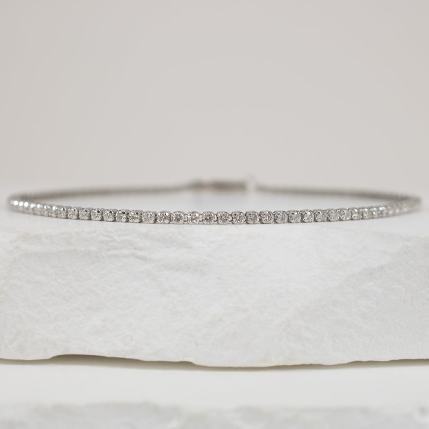 14KW 1.25CT Featherbrite Diamond Tennis Bracelet
14K White Gold Featherbrite Natural Diamond Tennis Bracelet
1.25 Cararts Round Brilliant Cut Natural Diamonds of I1-I2 Clarity, G-I Colour
7.5' Bracelet Length