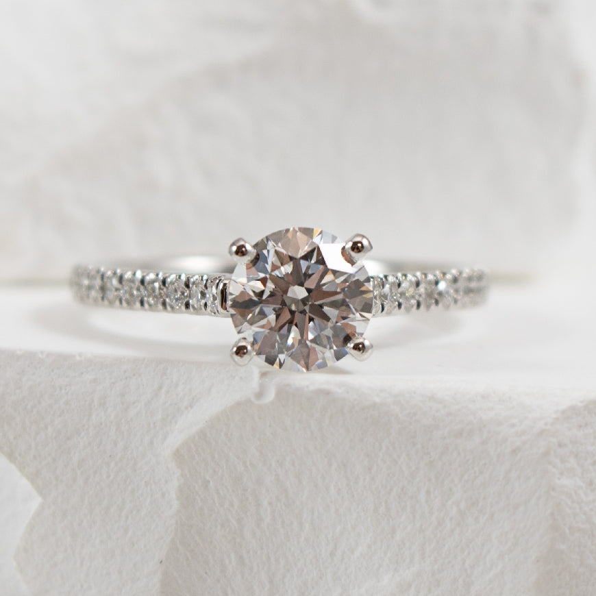 14KW Gabriel & Co. Diamond Engagement Ring       
14K White Gold Gabriel & Co. Lab Grown & Natural Diamond Accented Engagement Ring 
Center - 1.12 Carat Round Brilliant Cut Lab Grown Diamond of VS1 Clarity, E Colour, Ideal/ Excellent/ Excellent