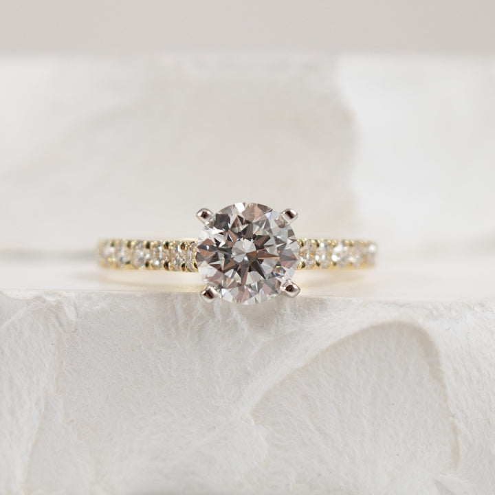 14KY Gabriel & Co. Diamond Engagement Ring 
14K Yellow Gold Gabriel & Co. Lab Grown & Natural Diamond Accented Engagement Ring 
Center - 1.12 Carat Round Brilliant Cut Diamond of VS1 Clarity, E Colour, Excellent/ Excellent/ Excellent Cut, IGI C