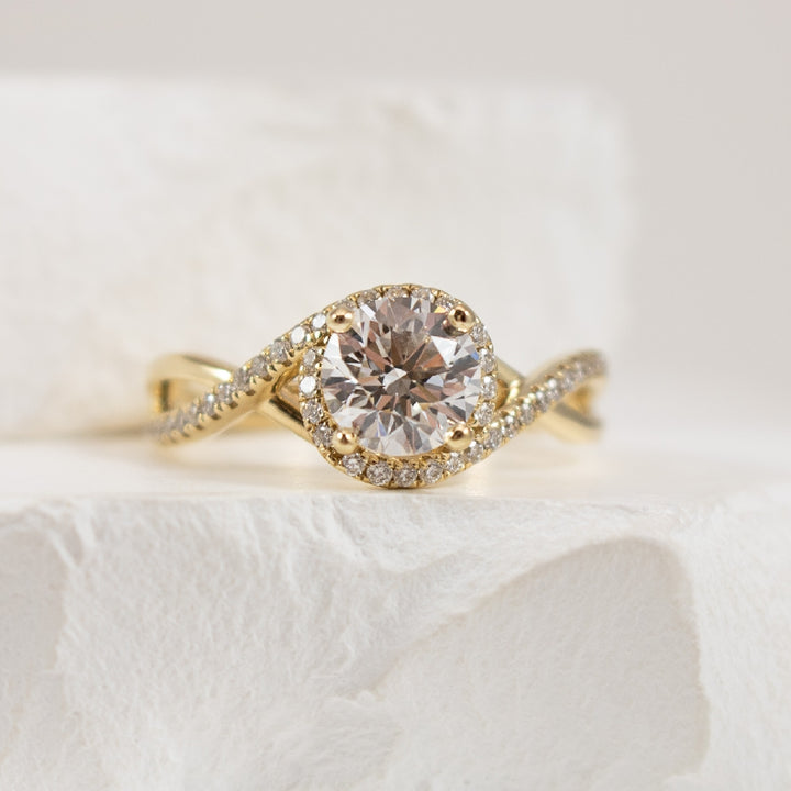 14KY Gabriel & Co. Diamond Accented Ring             
14K Yellow Gold Gabriel & Co. Lab Grown & Natural Diamond Accented Ring  
Center - 1.03 Carat Round Brilliant Cut Lab Grown Diamond of VVS2 Clarity, E Colour, Ideal/ Excellent/ Excellent Cut