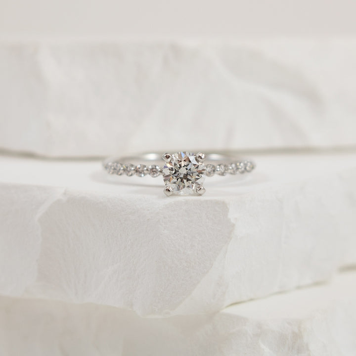 Platinum 0.60CT Floating Diamond Engagement Ring  
Platinum S.Kashi Natural Diamond Accented Engagement Ring 
Center - 0.60 Carat Round Brilliant Cut Natural Diamond of SI2 Clarity, F Colour, Very Good Cut 
 
Accent - 0.16 Carats Round Brilli