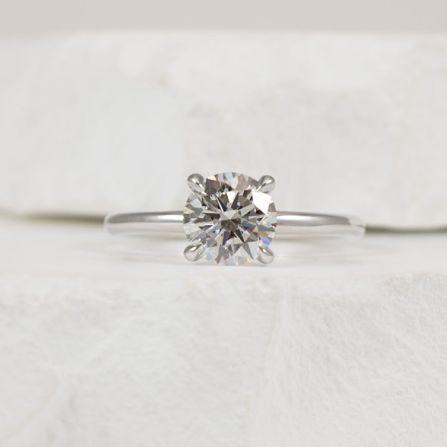 14KW 1.07CT Diamond Solitaire Engagement Ring     
14K White Gold Lab Grown Diamond Solitaire Engagement Ring  
Center - 1.07 Carat Round Brilliant Cut Lab Grown Diamond of  
VS1 Clarity, E Colour, Excellent/ Excellent/ Excellent Cut 
Finge