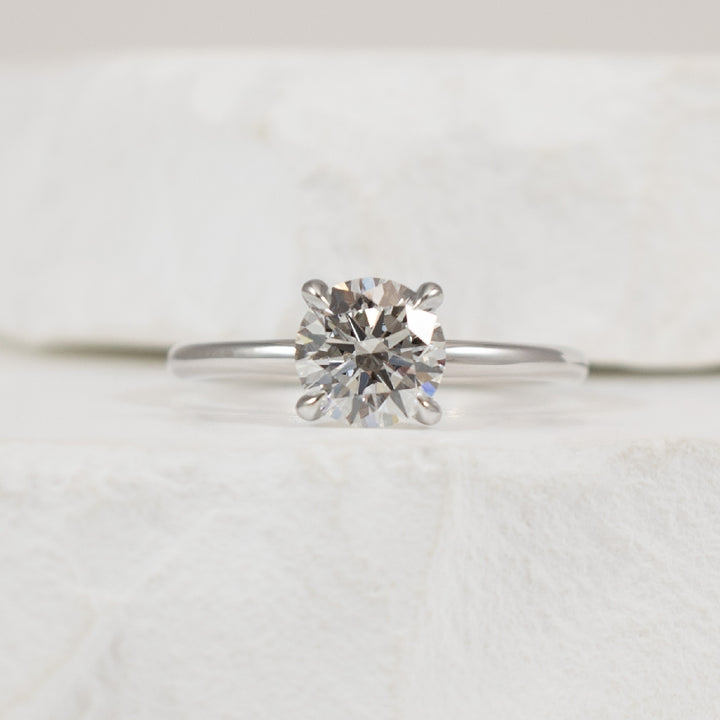 14KW 1.07CT Diamond Solitaire Engagement Ring     
14K White Gold Lab Grown Diamond Solitaire Engagement Ring  
Center - 1.07 Carat Round Brilliant Cut Lab Grown Diamond of  
VS1 Clarity, E Colour, Excellent/ Excellent/ Excellent Cut 
Finge