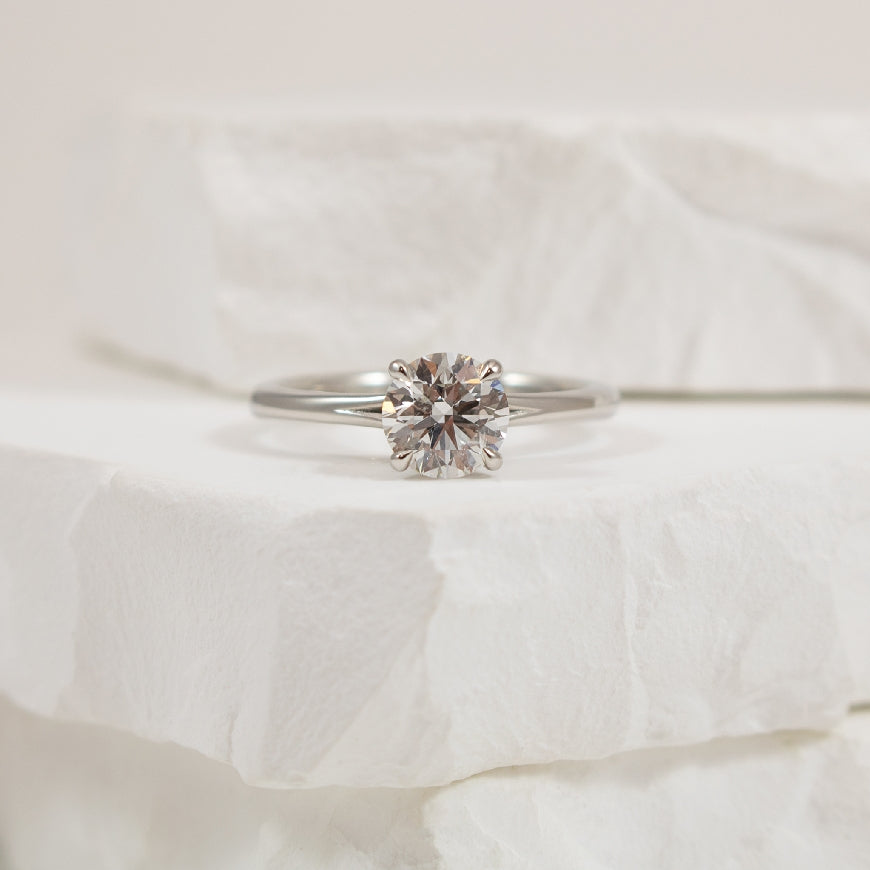 Platinum Forevermark Diamond Engagement Ring     
Platinum Forevermark Natural Diamond Solitaire Split Shank Engagement Ring 
Center - 1.03 Carat Round Brilliant Cut Natural Diamond SI2 Clarity, F Colour, Excellent/ Excellent/ Excellent Cut, Fo