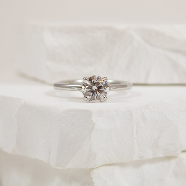 Platinum Forevermark Diamond Engagement Ring     
Platinum Forevermark Natural Diamond Solitaire Split Shank Engagement Ring 
Center - 1.03 Carat Round Brilliant Cut Natural Diamond SI2 Clarity, F Colour, Excellent/ Excellent/ Excellent Cut, Fo