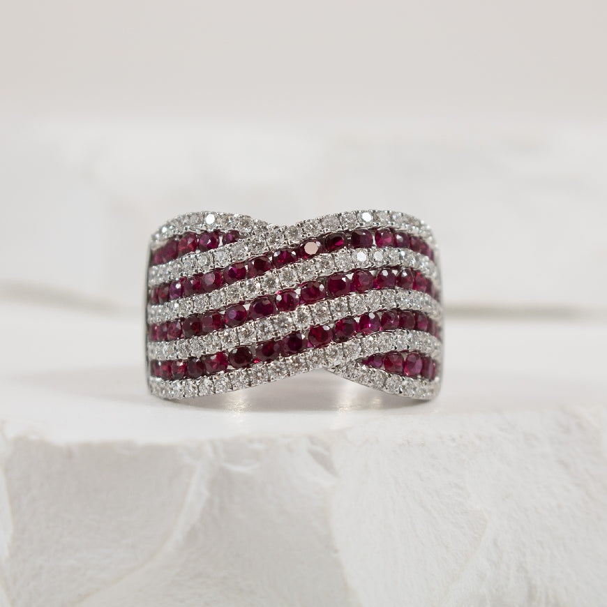 14KW Wide Ruby & Diamond Statement Ring     
14K White Gold Roman & Jules Ruby & Natural Diamond Wide Ring
1.37 Carat Ruby 
0.81 Total Natural Diamond Weight SI1-2 Clarity, GH Colour
Finger Size 6.5