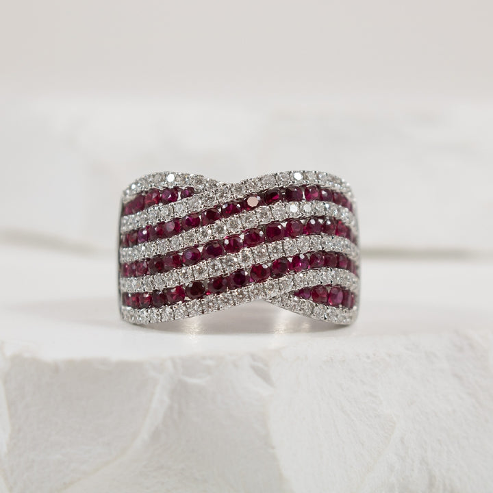 14KW Wide Ruby & Diamond Statement Ring     
14K White Gold Roman & Jules Ruby & Natural Diamond Wide Ring
1.37 Carat Ruby 
0.81 Total Natural Diamond Weight SI1-2 Clarity, GH Colour
Finger Size 6.5