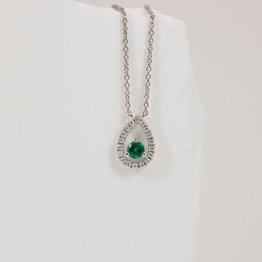 14KW Roman & Jules Emerald & Diamond Necklace     
14K White Gold Roman & Jules Emerald & Natural Diamond Necklace 
0.19 Carat Emerald 
0.13 Total Natural Diamond Weight SI Clarity, GH Colour
Chain Length 18' Adjustable