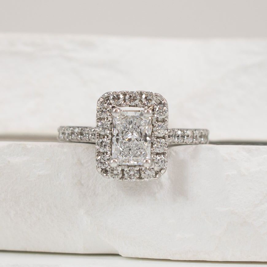 14KW Radiant Cut Halo Diamond Engagement Ring    
14K White Gold Lab Grown & Natural Diamond Radiant Cut Halo Engagement Ring 
Center - 1.02 Carat Radiant Cut Lab Grown Diamond of VS1 Clarity, D Colour, Excellent/ Excellent Cut 
Accent - 0.6