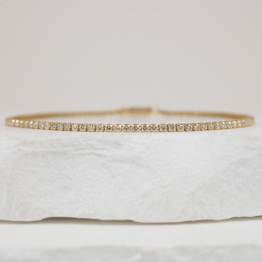 14KY 1.25CT Featherbrite Diamond Tennis Bracelet
14K Yellow Gold Featherbrite Natural Diamond Tennis Bracelet
1.25 Total Natural Diamonds Weight I1-I2 Clarity, G-I Colour
Bracelet Length 7'