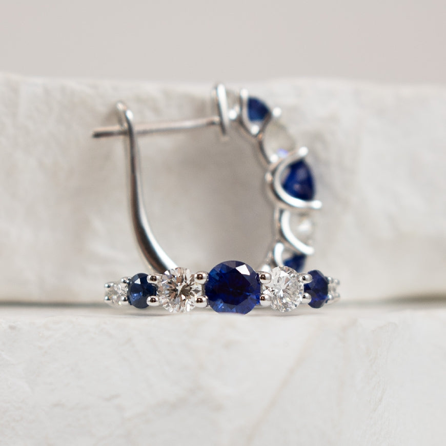 18KW Bassali Sapphire & Diamond Hoop Earrings
18K White Gold Bassali Sapphire & Diamond Hoop Earrings
0.75 Total Sapphire Weight
0.54 Total Natural Diamond Weight
Earring Closure Hinged Hoop