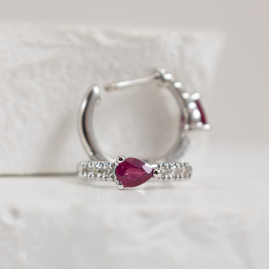 10KW Pear Shaped Ruby & Diamond Hoop Earrings
10K White Gold Pear Shaped Ruby & Diamond Huggie Hoop Earrings
0.10 Total Natural Diamond Weight
Earring Closure Huggie Hoop