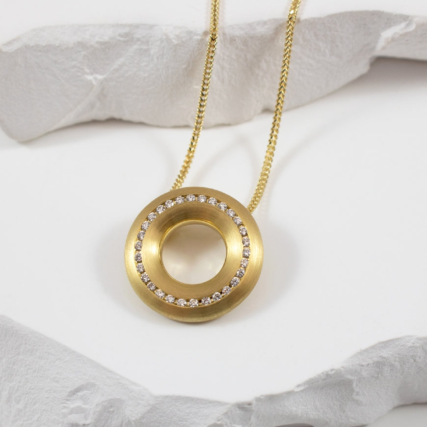 14KY Brushed Open Circle Diamond Necklace
14K Yellow Gold Breuning Natural Diamond Necklace
0.195 Total Natural Diamond Weight SI Clarity, H Colour
Chain Length 18'