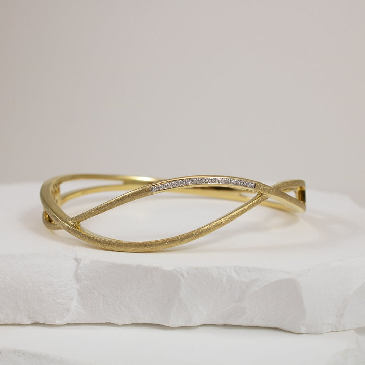 14KY Wavey Brushed Gold Diamond Bangle Bracelet    
14K Yellow Gold Breuning Natural Diamond Bangle Bracelet
0.08 Total Natural Diamond Weight SI Clarity, H Colour