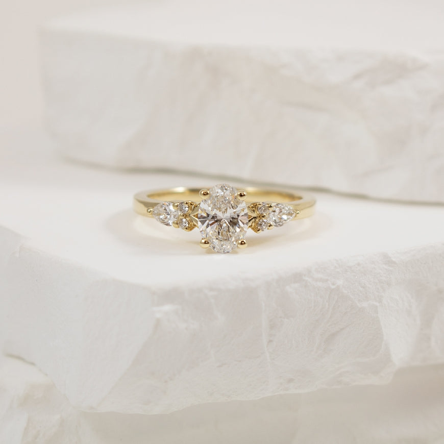 14KY Oval & Multi Shape Diamond Engagement Ring   
14K Yellow Gold Lab Grown Diamond Oval Cut & Multi Shape Engagement Ring 
Center - 0.72CT Oval Cut Lab Grown Diamond of VS1 Clarity, D Colour, Excellent/ Excellent Cut, IGI Certified 
Accent