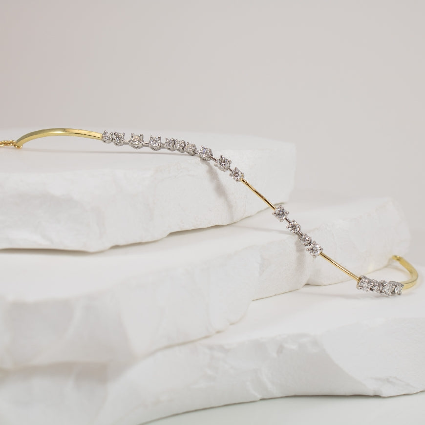18KY/W Spaced Diamond Tennis Bracelet
18K Yellow & White Gold Norman Covan Natural Diamond Bracelet
1.03 Total Natural Diamond Weight
Bracelet Length 8'