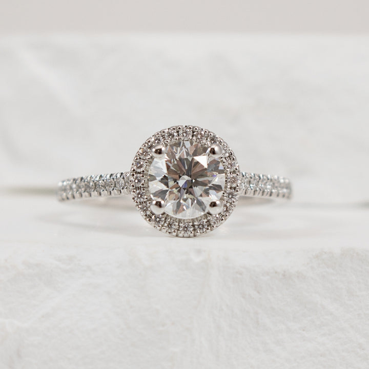 14KW Naledi Halo 0.90CT Diamond Engagement Ring  
14K White Gold Naledi Natural Round Diamond Halo Ring 
Center - 0.90 Carat Round Brilliant Cut Natural Diamond   VS2 Clarity, G Colour, Excellent/ Excellent/ Excellent Cut, GIA Certified 
Acc