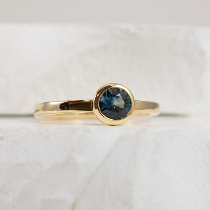 14KY Montana Sapphire Bezel Set Ring              
14K Yellow Gold Montana Sapphire Bezel Set Ring 
0.59 Total Round Cut Montana Sapphire 
Finger Size 6.5