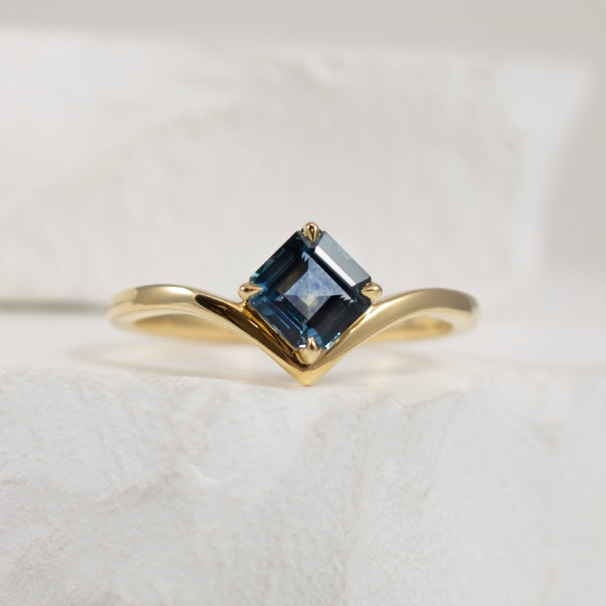 14KY Montana Sapphire Chevron Ring                
14K Yellow Gold Montana Sapphire Chevron Ring 
0.92 Carat of Square Montana Sapphire 
Finger Size 6.5