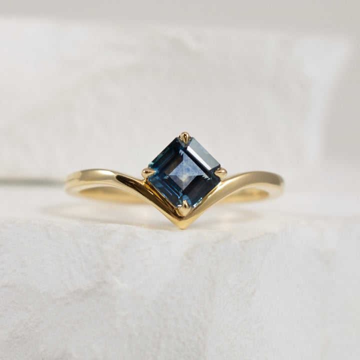 14KY Montana Sapphire Chevron Ring                
14K Yellow Gold Montana Sapphire Chevron Ring 
0.92 Carat of Square Montana Sapphire 
Finger Size 6.5