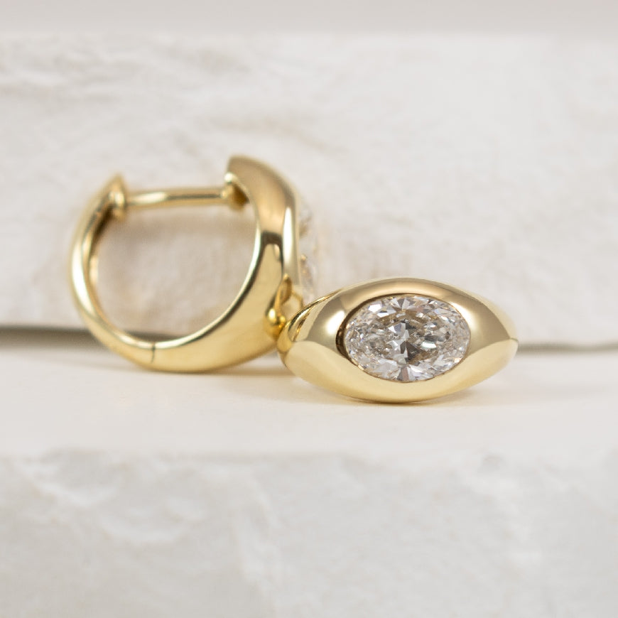 14KY Oval Cut Domed Huggie Hoop Earrings
14K Yellow Gold Lab Grown Diamond Oval Cut Domed Huggie Hoop Earrings
1.00 Total Lab Grown Oval Cut Diamond Weight VS2 Clarity, F Colour
Earring Closure Huggie Hoop