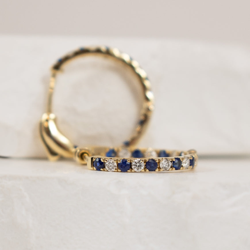 14KY Inside-Out Sapphire & Diamond Hoop Earrings  
14K Yellow Gold Roman & Jules Natural Diamond & Sapphire Inside-Out Hoop Earrings 
0.39 Total Sapphire Weight 
0.25 Total Natural Diamond Weight SI1-2 Clarity, G-H Colour 
0.50' Diameter