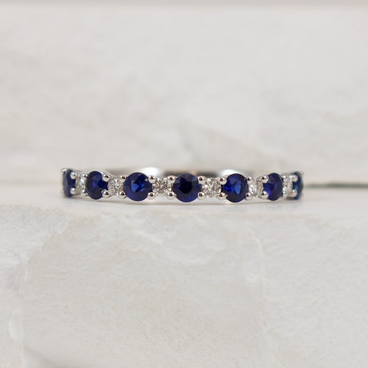 14KW Roman & Jules Classic Sapphire & Diamond Band
14K White Gold Roman & Jules Natural Diamond & Sapphire Band
0.46 Carats Round Sapphires 
0.08 Carats Round Brilliant Cut Natural Diamonds of SI1-2 Clarity, G-H Colour 
Size 6.5